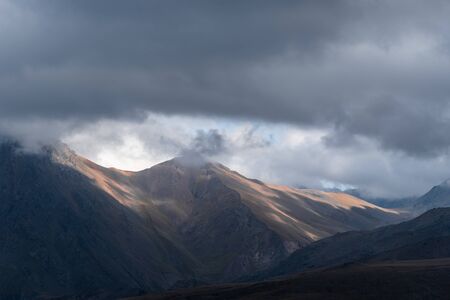 beautiful landscape in the highlands, textural hills with incident light.