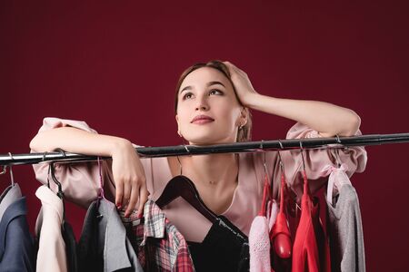 Nothing to wear concept, young woman deciding what to put on