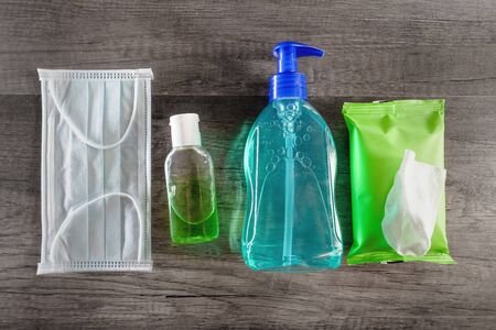 Personal protective equipment against viruses, personal hygiene concept, antiseptic gel, disinfectant wipes, medical gloves. Protection against infections and coronovirusの写真素材