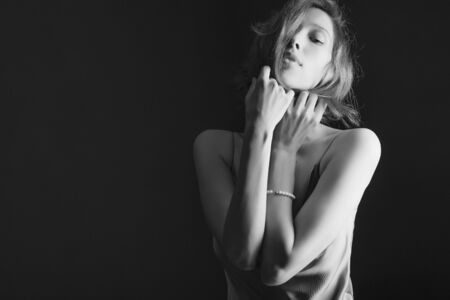 Portrait of a beautiful, sexy girl. Black and white art photo. The concept of beauty and youthの写真素材