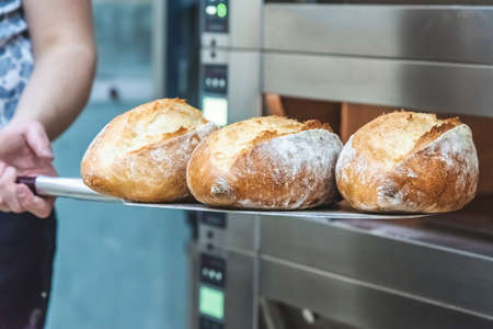 Craft bread on the table at the bakery. The concept of small industries and healthy food