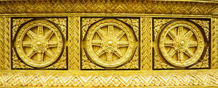 golden buddhism wheel of the dharmaの写真素材