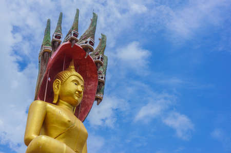 a Buddha with a naga over His head at Wat Nang Lao in songkhla ,thailandの写真素材