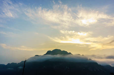 dawn in mist at khao sok,surat thani,thailandの写真素材