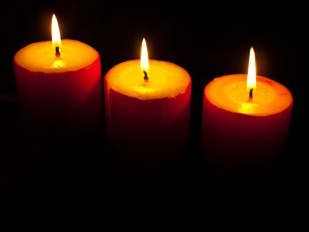 Burning red candles on the blackの写真素材