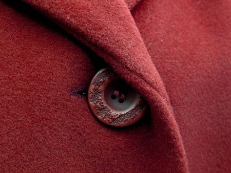 Red button on the coatの写真素材