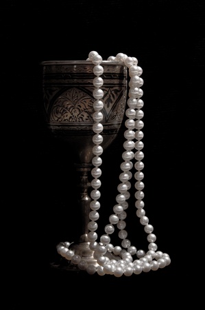 Pearl beads with silver wineglassの写真素材