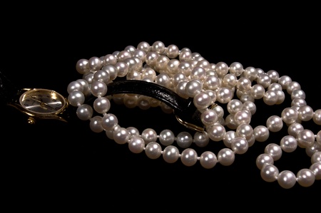 Pearl beads with female gold watchの写真素材