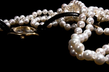 Pearl beads with female gold watchの写真素材
