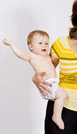 Little girl on her mother handsの写真素材