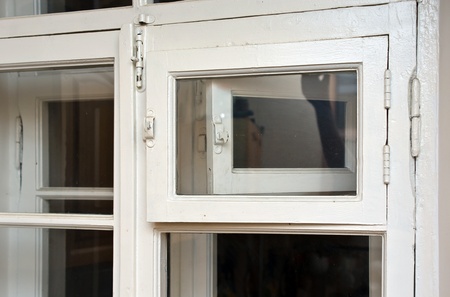 Old wooden window with opened frame