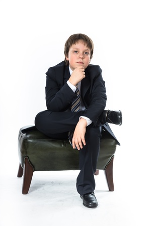 Office style dressed young boy isolated on whiteの写真素材