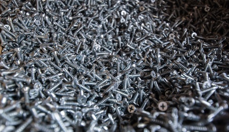 Many screws in a box on window manufacturing plantの写真素材