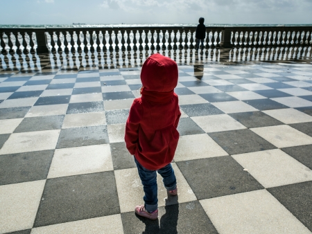 Little child looking at seaの写真素材