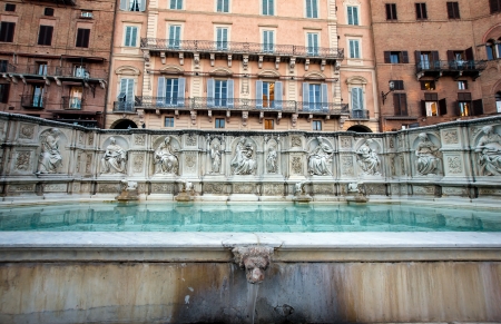 Beautiful fountain on central place of Siena, Tuscany, Italyの写真素材