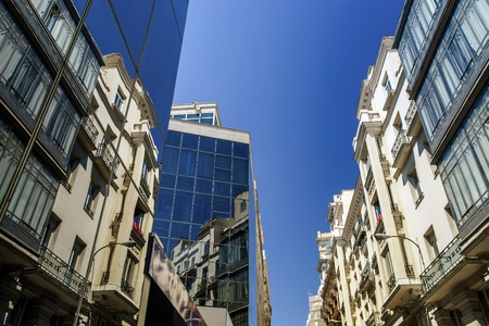 Reflection of Madrid street in modern glass building wallのeditorial素材