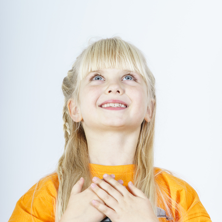 Cute little towhead girl portrait isolated on white の写真素材