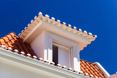 Contrast and colorful tile roofs view. Ericeira, Portugal.の写真素材