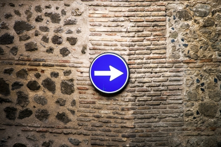 Classical road sign on ancient wall in old city centerの写真素材