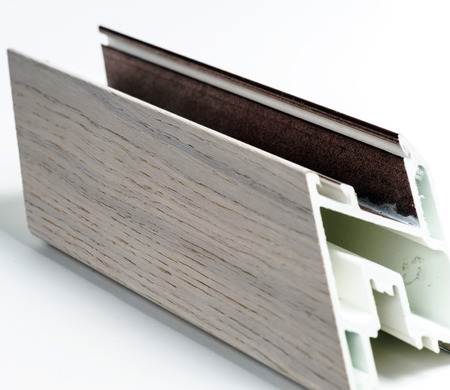 Fiberglass window profile sample covered by thin wood layerの写真素材