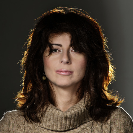 Young woman portrait. Fashion style. Knitted dress.の写真素材