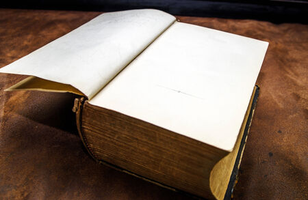 Old vintage book with blank pages on brown backgroundの写真素材