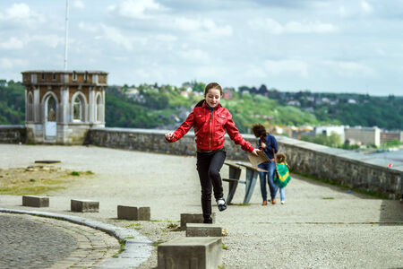 Happy teenage traveler in Namur castle, Belgiumの写真素材