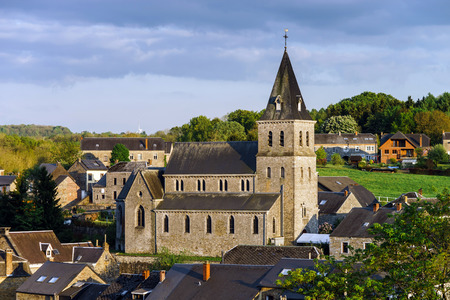 Old medieval church in small village. Belgium countryside.の写真素材