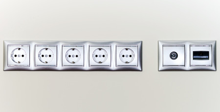 Electric sockets in line, house interior detailsの写真素材