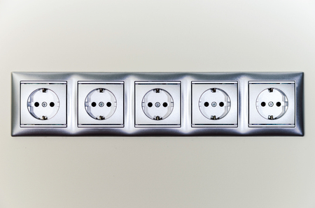 Electric sockets in line, house interior details