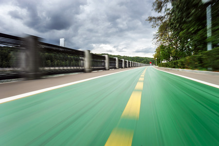 Bicycle path along the river quay, public parkの写真素材