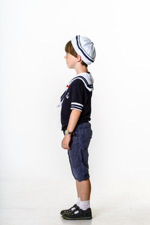 Cute little carroty boy dressed in sailor suitの写真素材