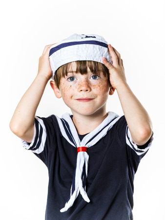 Cute little carroty boy dressed in sailor suitの写真素材