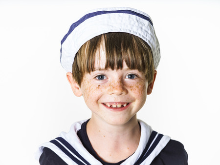 Cute little carroty boy dressed in sailor suitの写真素材