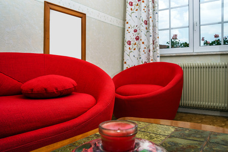 Red round sofa in countryside renovated houseのeditorial素材