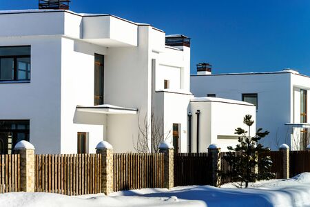 Modern country house, winter sunny day, snow and sunのeditorial素材
