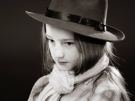 Cute teenage girl with father's hat  close-up portrait, fashion
