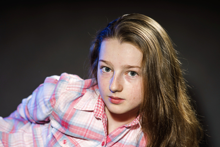 Cute teenage girl close-up portrait, long hair styleの写真素材