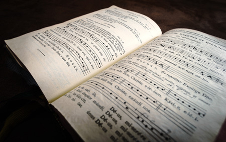 Vintage psalm book with chorus singing notes closeupの写真素材