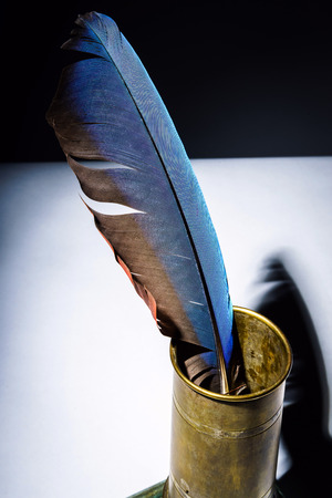 Vintage inkpot with goose-quill inside, retro writing instrumentの写真素材