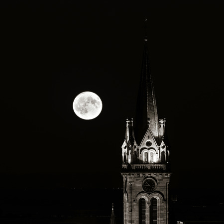 Beautiful moonrise over the church, Alsace, Dambach-la-ville, Franceの写真素材