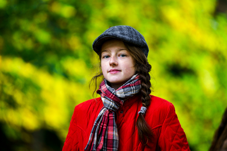 Cute teenage girl autumnal portrait in the parkの写真素材