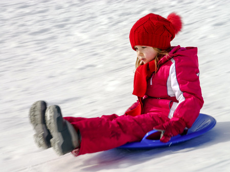 Little girl with snow sleds, winter leisureの写真素材