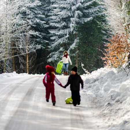 Greasy winter road in beautiful forest, dangerous ridingの写真素材
