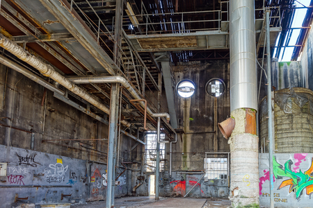 Old abandoned plant with graffity on walls, destroyed ruinsのeditorial素材