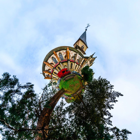 Funny sperical view of medieval church in little village in France. Little planet effect of...