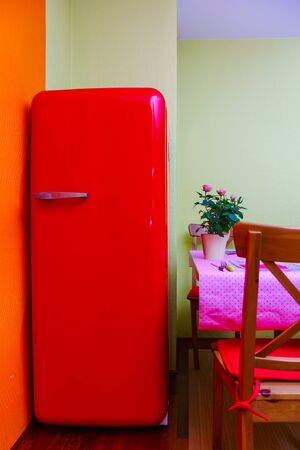 Retro-styled red refrigerator in the kitchen room, vintage styleの写真素材