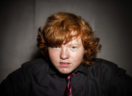 Emotive portrait of red-haired freckled boy, actor portfolio, childhood conceptの写真素材