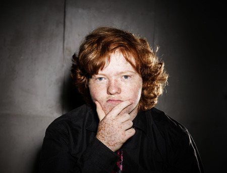 Emotive portrait of red-haired freckled boy, actor portfolio, childhood conceptの写真素材