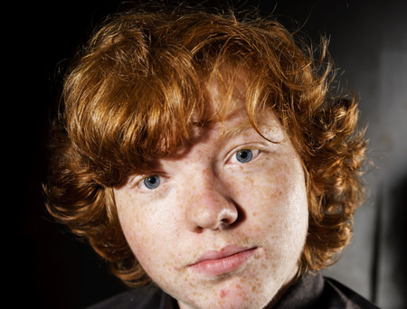 Emotive portrait of red-haired freckled boy, actor portfolio, childhood conceptの写真素材
